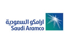 White tile with the words Saudi Aramco written in turquoise next to a logo with a silver star.