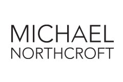White tile with the words 'Michael Northcroft' written in black.