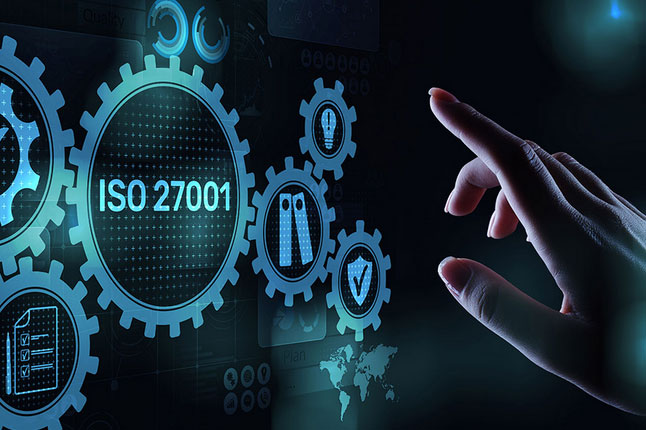 Finger hovering over a touch screen with gears and 'ISO 27001' written in blue.