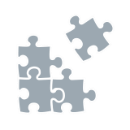 Grey tile with icons of four puzzle pieces.