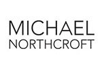White tile with the words 'Michael Northcroft' written in black.